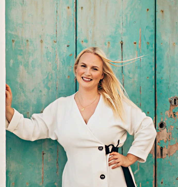 Woman posing at a door